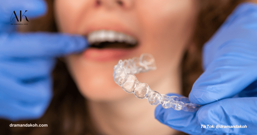 Dentist Fitting Invisalign Into Patient - Dr Amanda Koh