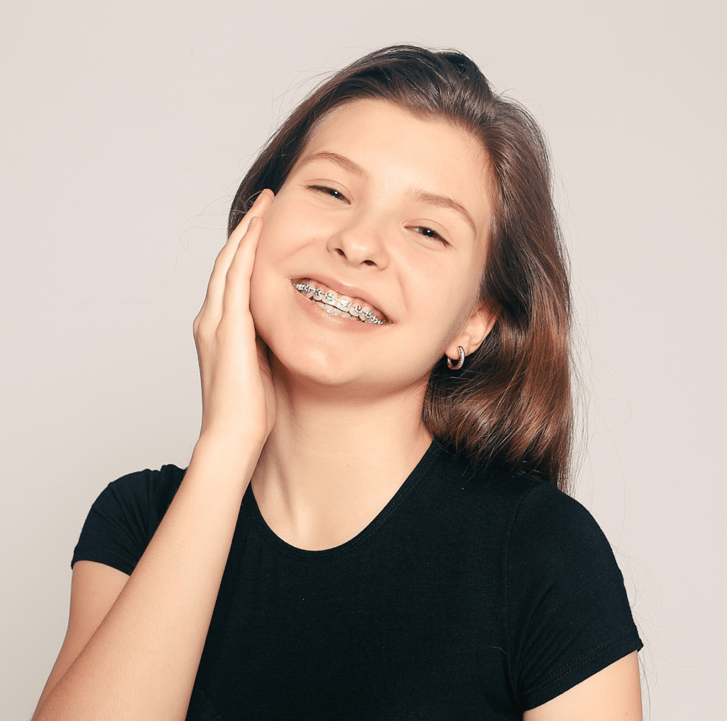 Woman Smiling With Braces - Dr Amanda Koh